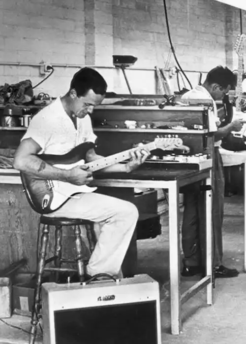 George Fullerton testing a Stratocaster at the Fender factory sometime in the mid-to-late 1950s