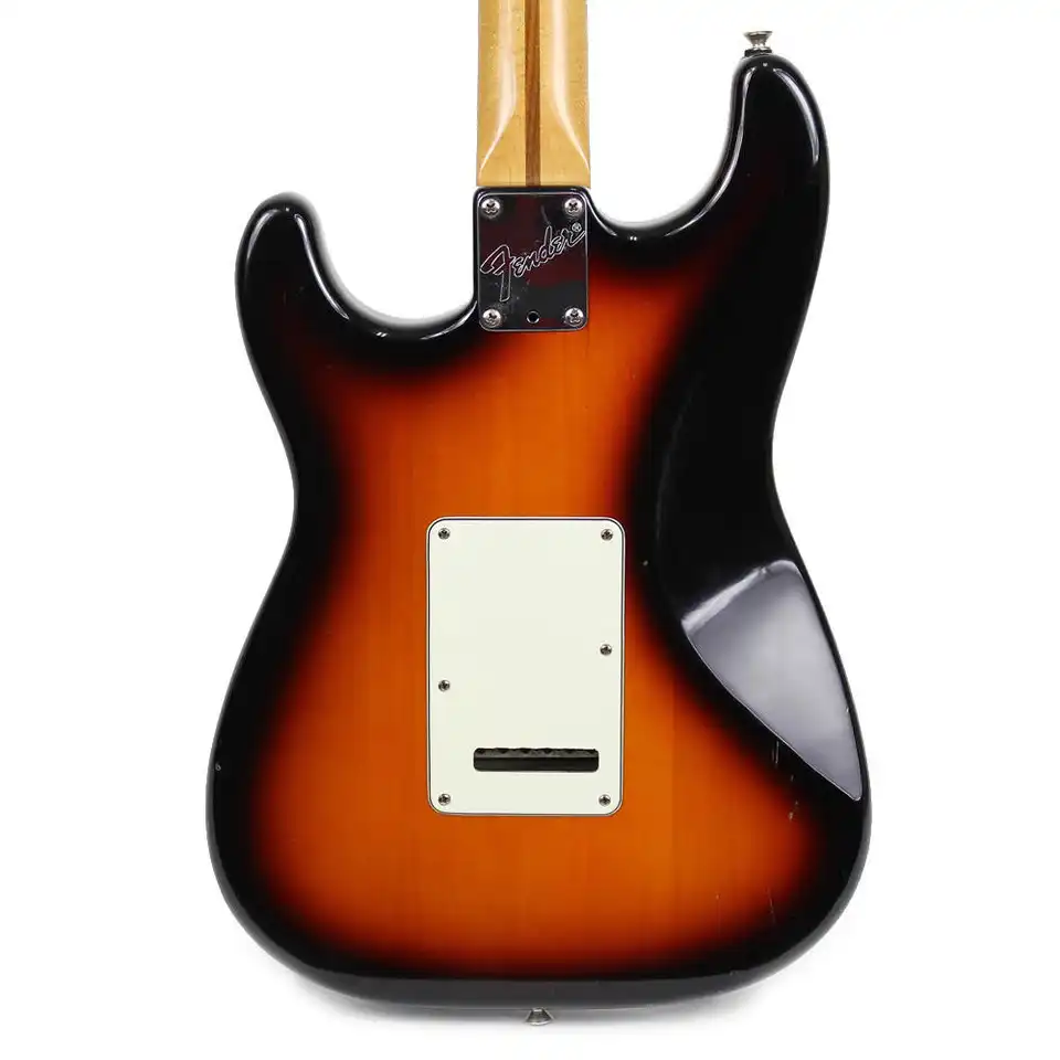 The sunburst finish, with the entire back concavity painted black, was used to hide a veneered top and back
