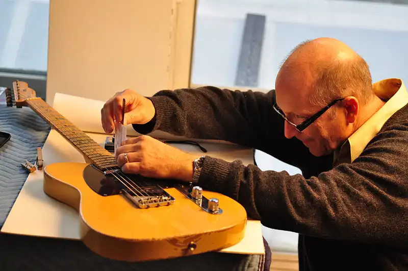 Fender R&D engineer George Blanda takes key measurements.