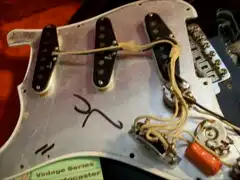 JC Sticker on the aluminum shield of a Vintage Reissue Stratocaster