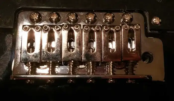 The new low-budget bridge design used on Korean-made Stratocasters