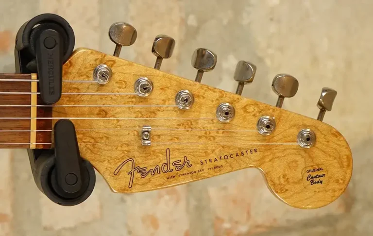 Headstock of a Custom Classic 1960 Stratocaster — note the exceptional quality of the selected wood and the premium cosmetic appointments reflecting early-1990s aesthetic sensibilities