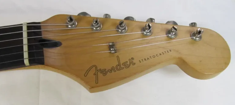 Tex-Mex headstock featuring the Spaghetti logo, vintage-style tuning machines, and a standard truss rod with black plastic insert