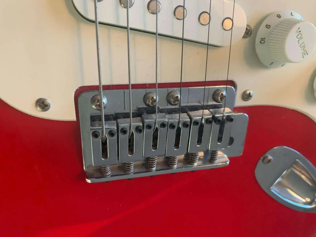 The four-screw neck plate of the first Chinese-made Squier Stratocaster
