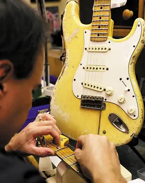 John Cruz working on the prototype of the “Play Loud” Tribute Replica Stratocaster