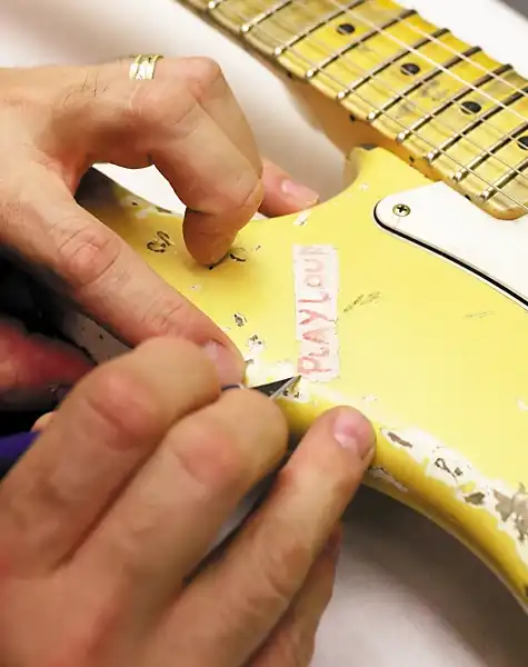 John Cruz working on the prototype of the “Play Loud” Tribute Replica Stratocaster