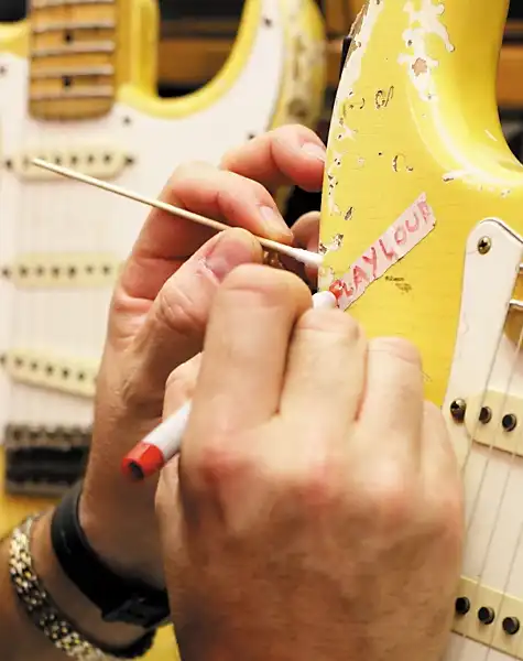John Cruz working on the prototype of the “Play Loud” Tribute Replica Stratocaster