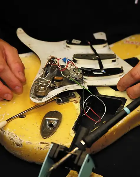 John Cruz working on the prototype of the “Play Loud” Tribute Replica Stratocaster