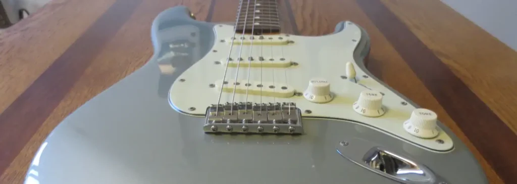 The flat-pole bridge pickup versus the staggered-pole pickups in the neck and middle positions