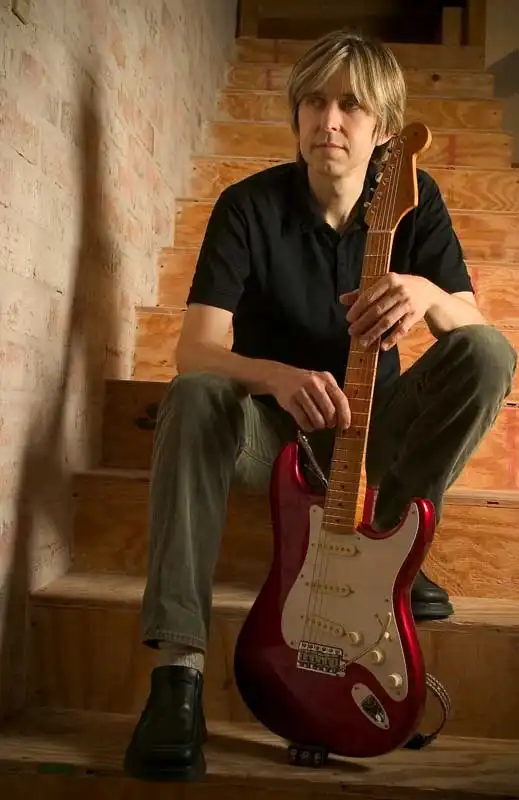 Eric Johnson with his signature model bearing the serial number EJ00001