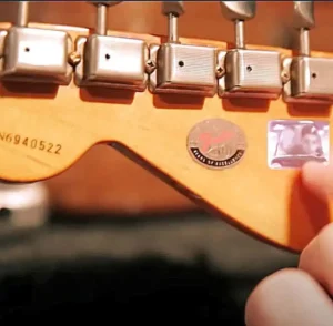 The sticker Mayer applied to the back of the headstock, seen in Paradise Valley Studio Sessions