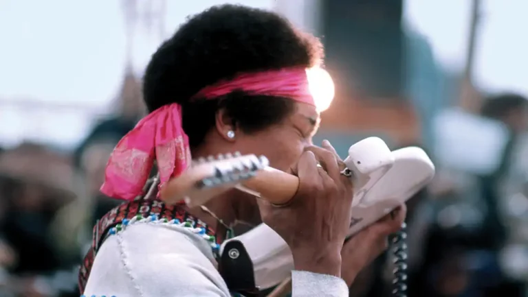 Jimi Hendrix playing "Izabella" with his teeth at the Woodstock Festival