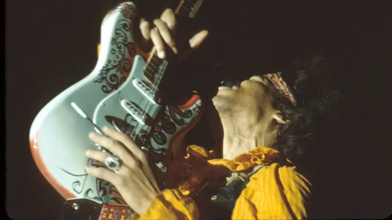 Jimi Hendrix playing the Stratocaster he painted.